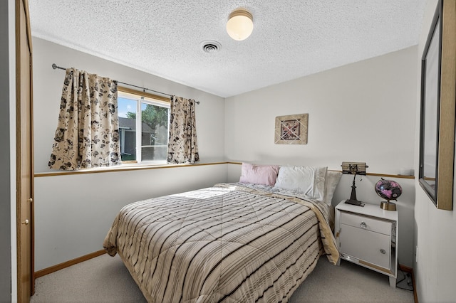 7217 92nd Trl N, Brooklyn Park, MN 55445 - carpeted bedroom featuring a textured ceiling and baseboards