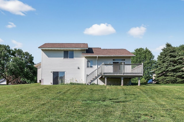 7217 92nd Trl N, Brooklyn Park, MN 55445 - rear view of property featuring a wooden deck and a lawn