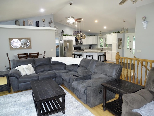 568 Midway Rd, Menomonie, WI 54751 - living room with ceiling fan, vaulted ceiling, light wood finished floors, and recessed lighting