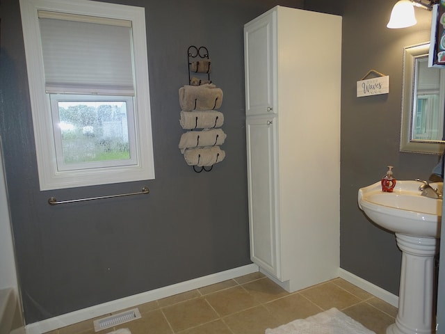 568 Midway Rd, Menomonie, WI 54751 - bathroom with tile patterned flooring and baseboards