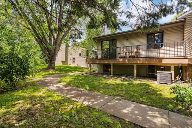 4463 Arden View Ct, Arden Hills, MN 55112 - rear view of house with a chimney, a lawn, and a deck
