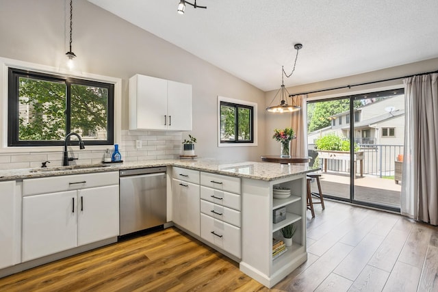 4463 Arden View Ct, Arden Hills, MN 55112 - kitchen featuring stainless steel dishwasher, lofted ceiling, open shelves, a peninsula, and plenty of natural light