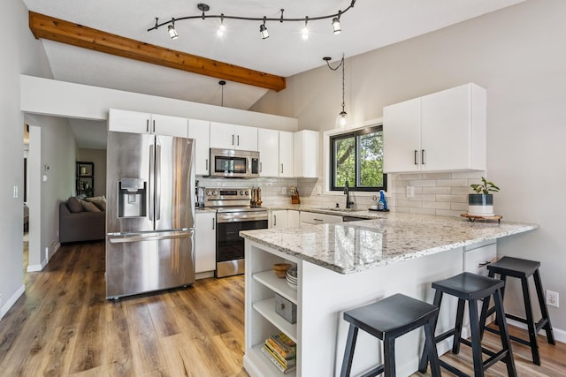 4463 Arden View Ct, Arden Hills, MN 55112 - kitchen featuring stainless steel appliances, a peninsula, tasteful backsplash, and light stone counters