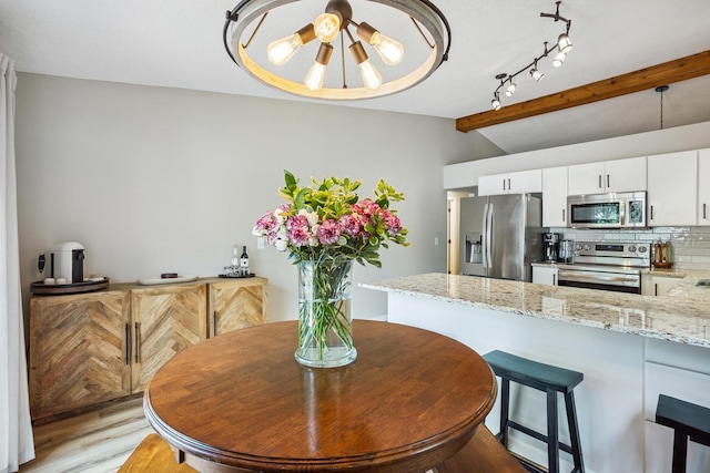 4463 Arden View Ct, Arden Hills, MN 55112 - dining area featuring light wood finished floors and track lighting