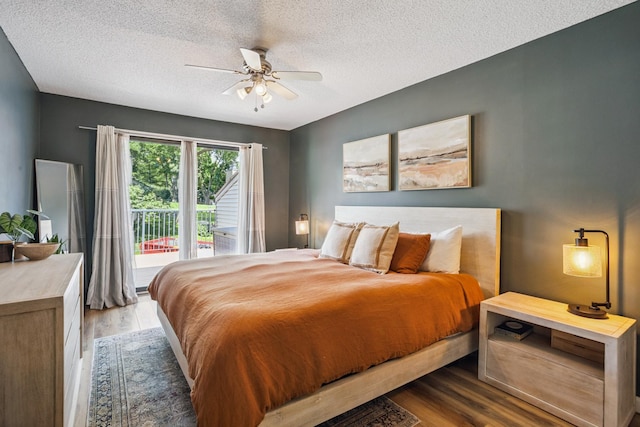 4463 Arden View Ct, Arden Hills, MN 55112 - bedroom with access to exterior, wood finished floors, a textured ceiling, and ceiling fan