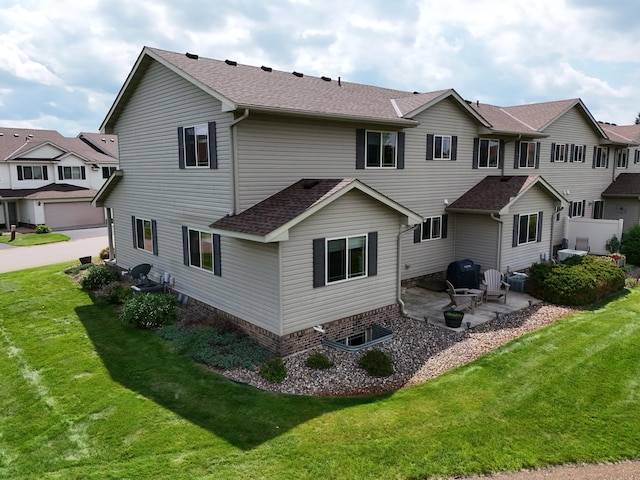 519 Graceview Loop, Saint Joseph, MN 56374 - rear view of house with a patio, a shingled roof, a yard, and a residential view