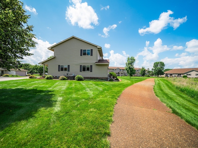 519 Graceview Loop, Saint Joseph, MN 56374 - view of property exterior with a lawn and a central air condition unit