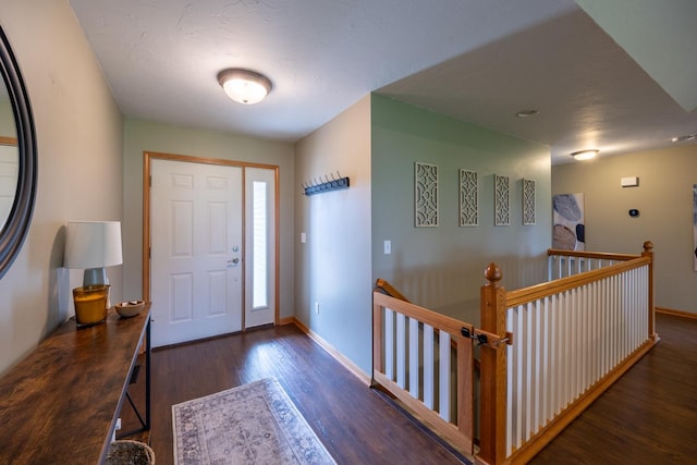 1100 27th St SW, Austin, MN 55912 - foyer featuring wood finished floors and baseboards