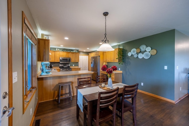 1100 27th St SW, Austin, MN 55912 - dining space with dark wood-type flooring and recessed lighting