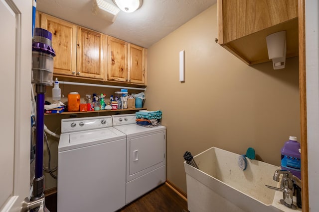 1100 27th St SW, Austin, MN 55912 - laundry room with cabinet space, independent washer and dryer, and dark wood-style floors
