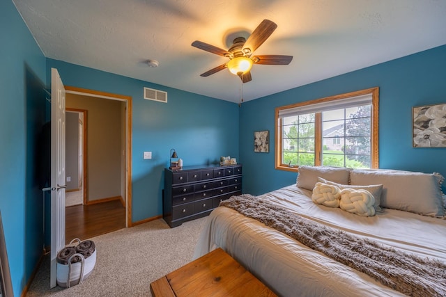 1100 27th St SW, Austin, MN 55912 - carpeted bedroom with a ceiling fan and baseboards