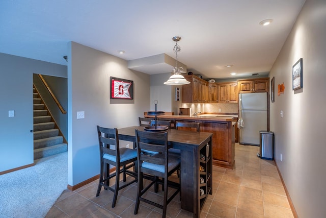 1100 27th St SW, Austin, MN 55912 - dining space featuring stairway, recessed lighting, and light tile patterned flooring
