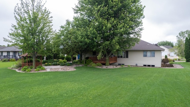 1100 27th St SW, Austin, MN 55912 - view of grassy yard featuring a deck and a gazebo