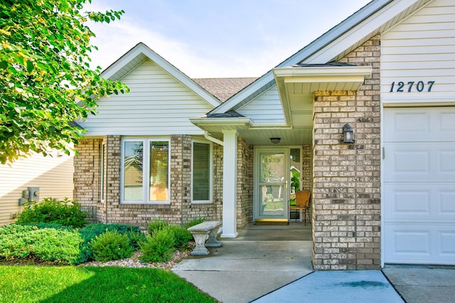 12707 Ivywood St NW, Coon Rapids, MN 55448 - entrance to property featuring a garage and roof with shingles