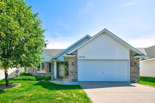 12707 Ivywood St NW, Coon Rapids, MN 55448 - view of front of property with driveway, a garage, a front lawn, and brick siding