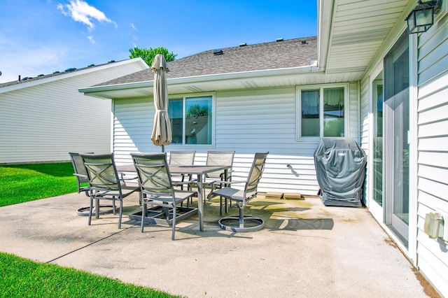 12707 Ivywood St NW, Coon Rapids, MN 55448 - view of patio / terrace featuring a grill and outdoor dining space