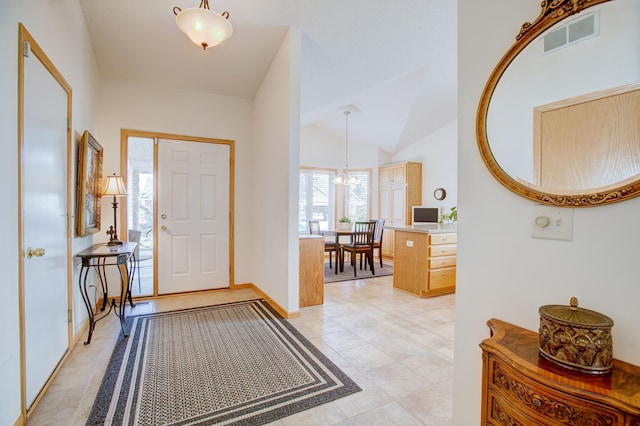 12707 Ivywood St NW, Coon Rapids, MN 55448 - foyer featuring lofted ceiling and light tile patterned flooring