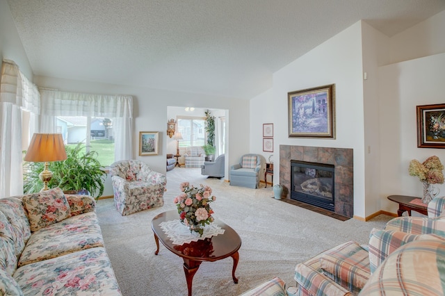 12707 Ivywood St NW, Coon Rapids, MN 55448 - living room with carpet, lofted ceiling, a tile fireplace, and a textured ceiling