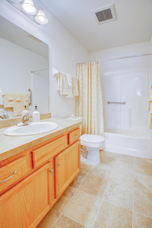 12707 Ivywood St NW, Coon Rapids, MN 55448 - bathroom featuring vanity, a textured ceiling, and shower / tub combo