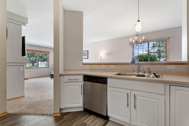 3214 Juniper Cir Unit C, Woodbury, MN 55125 - kitchen featuring stainless steel dishwasher, white cabinets, dark wood-style flooring, light countertops, and a chandelier