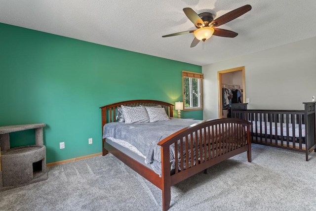 3214 Juniper Cir Unit C, Woodbury, MN 55125 - bedroom featuring carpet, a ceiling fan, a textured ceiling, and a walk in closet