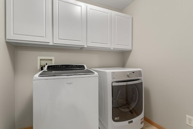 3214 Juniper Cir Unit C, Woodbury, MN 55125 - laundry area featuring cabinet space and separate washer and dryer