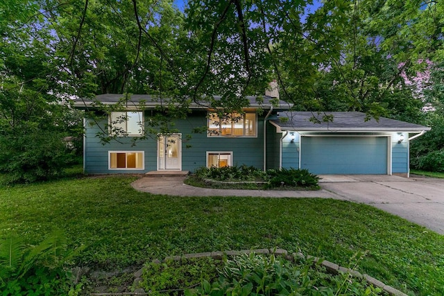 801 Corens Dr, Minnetonka, MN 55305 - raised ranch featuring driveway, an attached garage, a front lawn, and a chimney