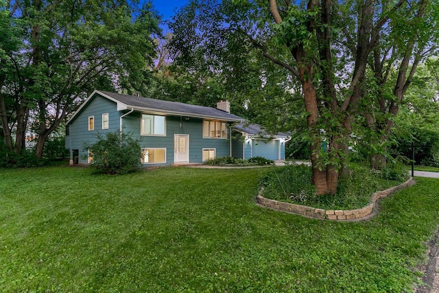801 Corens Dr, Minnetonka, MN 55305 - split foyer home featuring a chimney, a garage, and a front lawn