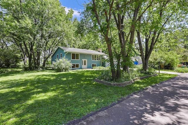 801 Corens Dr, Minnetonka, MN 55305 - bi-level home with a chimney and a front lawn