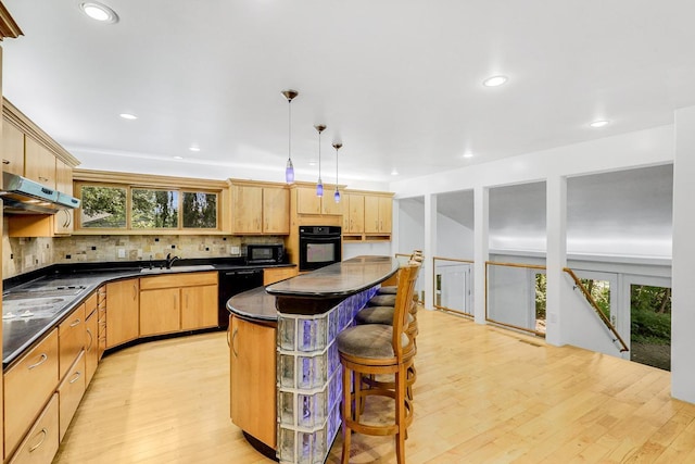 801 Corens Dr, Minnetonka, MN 55305 - kitchen featuring black appliances, dark countertops, under cabinet range hood, light brown cabinets, and healthy amount of natural light