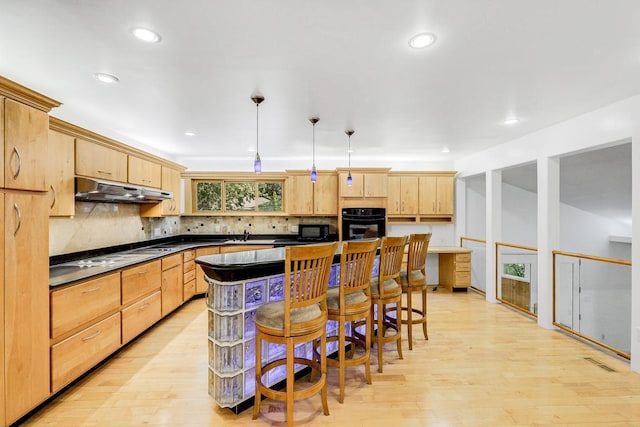 801 Corens Dr, Minnetonka, MN 55305 - kitchen featuring black appliances, under cabinet range hood, light brown cabinetry, dark countertops, and light wood-style floors