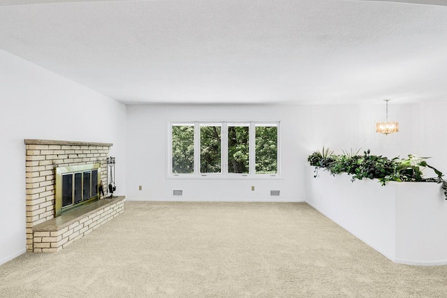 801 Corens Dr, Minnetonka, MN 55305 - unfurnished living room with carpet flooring, a brick fireplace, and a chandelier