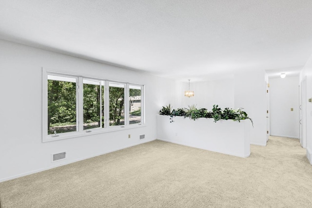 801 Corens Dr, Minnetonka, MN 55305 - empty room featuring a chandelier and light colored carpet