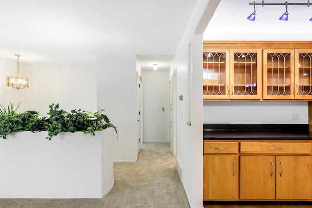 801 Corens Dr, Minnetonka, MN 55305 - hallway with light colored carpet and a chandelier