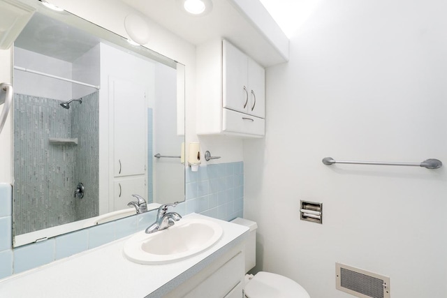 801 Corens Dr, Minnetonka, MN 55305 - bathroom with vanity, a shower, heating unit, and tile walls