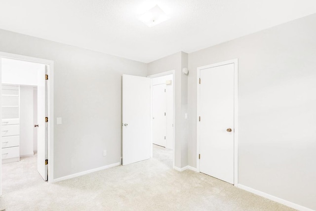 801 Corens Dr, Minnetonka, MN 55305 - unfurnished bedroom with a closet, light carpet, and a spacious closet