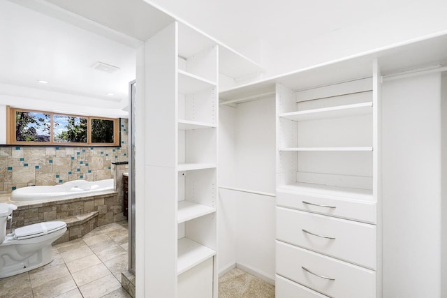 801 Corens Dr, Minnetonka, MN 55305 - walk in closet with light tile patterned floors