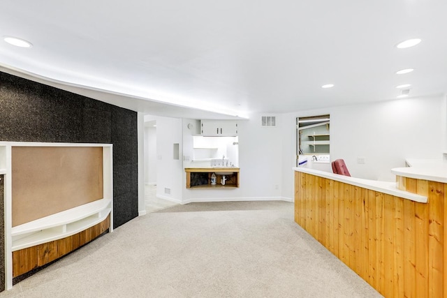 801 Corens Dr, Minnetonka, MN 55305 - unfurnished living room featuring light carpet, wet bar, recessed lighting, and washer / dryer