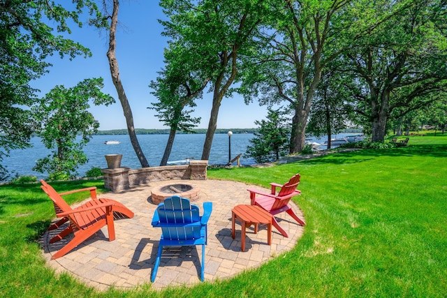 870 Andrew Dr NE, Lake Andrew Twp, MN 56273 - view of patio / terrace featuring an outdoor fire pit and a water view