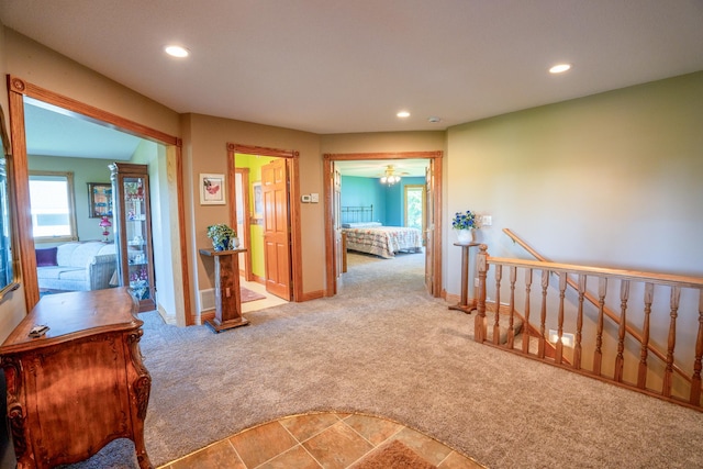 870 Andrew Dr NE, Lake Andrew Twp, MN 56273 - hallway with an upstairs landing, carpet floors, and recessed lighting