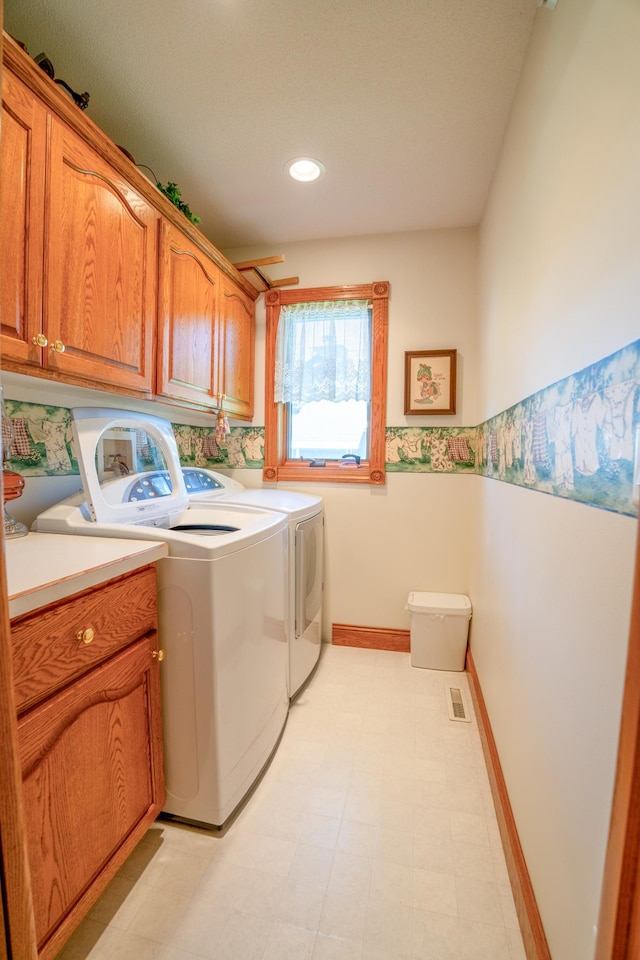 870 Andrew Dr NE, Lake Andrew Twp, MN 56273 - washroom with cabinet space, washer and dryer, and recessed lighting