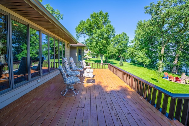 870 Andrew Dr NE, Lake Andrew Twp, MN 56273 - wooden terrace featuring a lawn and view of scattered trees