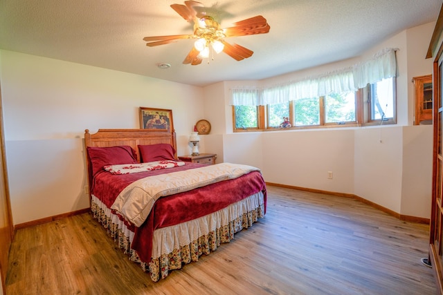 870 Andrew Dr NE, Lake Andrew Twp, MN 56273 - bedroom with wood finished floors and ceiling fan