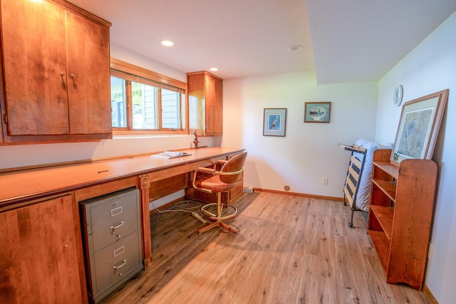 870 Andrew Dr NE, Lake Andrew Twp, MN 56273 - office area with light wood finished floors, built in desk, and recessed lighting