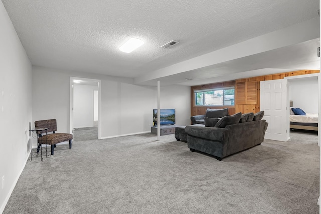 1620 7th St NW, New Brighton, MN 55112 - living area featuring a textured ceiling and carpet floors