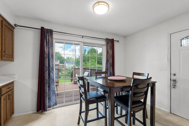 1620 7th St NW, New Brighton, MN 55112 - dining room featuring plenty of natural light, a textured ceiling, and light flooring