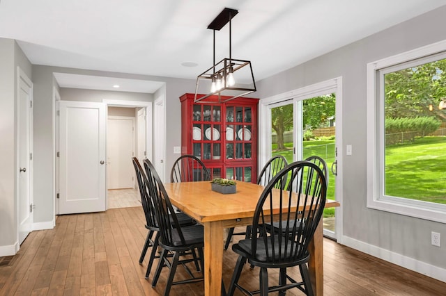 6712 Hillside Ln, Edina, MN 55439 - dining room featuring baseboards and hardwood / wood-style flooring