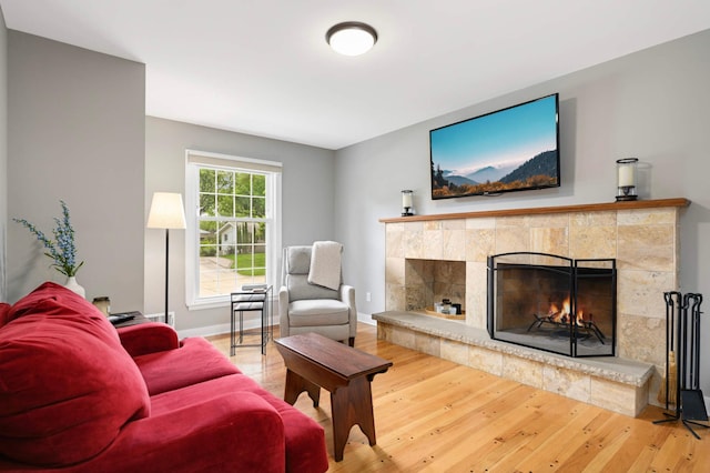 6712 Hillside Ln, Edina, MN 55439 - living room featuring a tile fireplace and wood finished floors