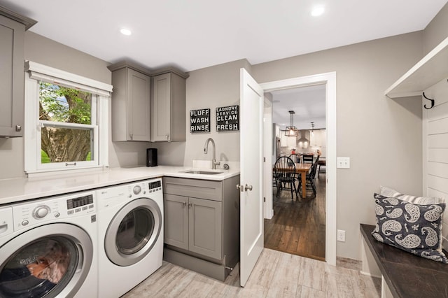6712 Hillside Ln, Edina, MN 55439 - laundry room with washer and dryer, cabinet space, light wood-style floors, and recessed lighting