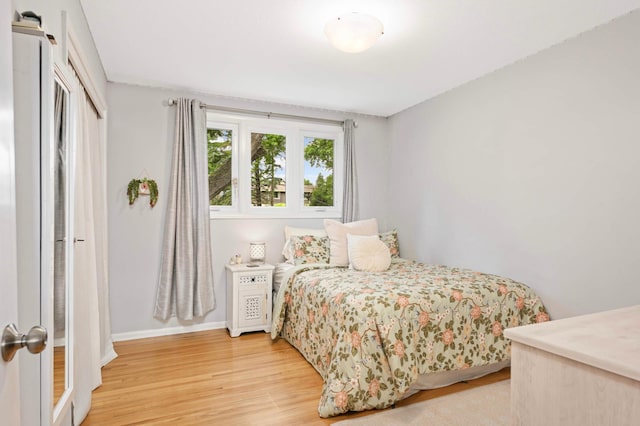 6712 Hillside Ln, Edina, MN 55439 - bedroom with light wood finished floors and baseboards